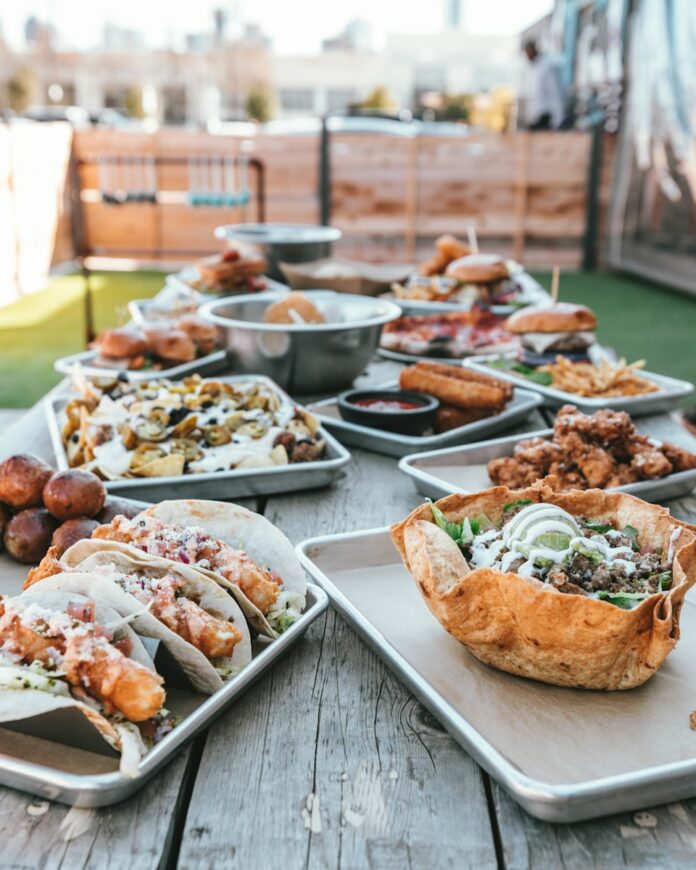 Photo by Spencer Davis selective focus photography of plates of food on table during daytime