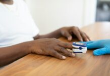 여성 갱년기 건강 관리 a person's hands on a table with a game controller