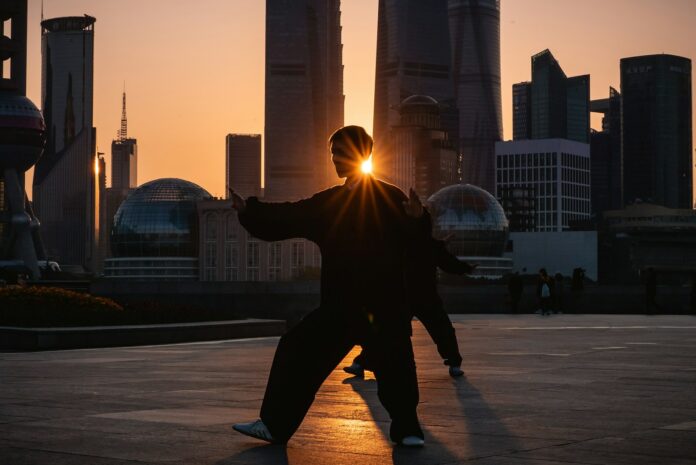 Photo by Kevin Olson silhouette of man near buildings