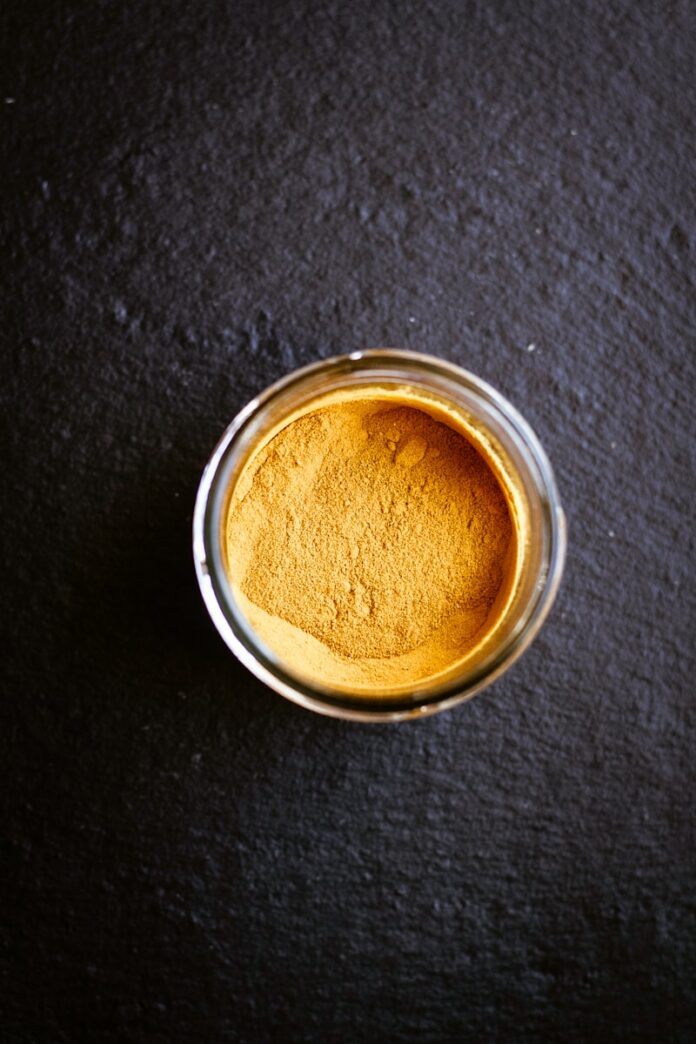 Photo by Lucas MARULIER clear glass cup with brown powder