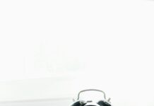 일상이 지치는 당신, 만성피로 벗어나는 생활 속 작은 변화들 white ceramic mug beside white and black analog alarm clock