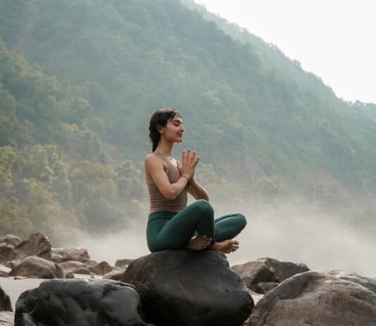 여성 건강관리, 일상 속 작은 변화가 만드는 큰 차이 a woman sitting on top of a rock next to a river