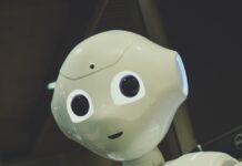 AI가 일상 속 건강 지킴이로…똑똑한 관리 비법은? white robot toy holding black tablet