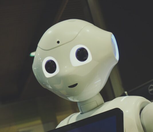 AI가 일상 속 건강 지킴이로…똑똑한 관리 비법은? white robot toy holding black tablet